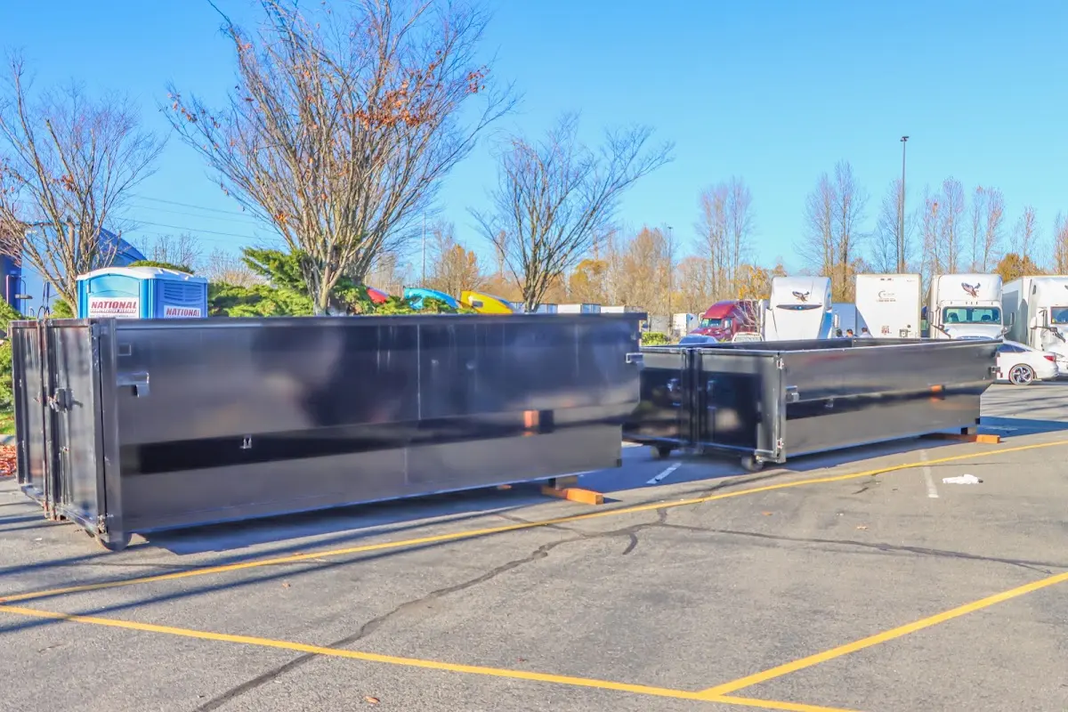 Professional dumpster rental service with roll-off container on residential driveway in Santee